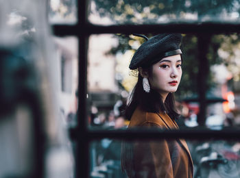 Portrait of young woman looking away