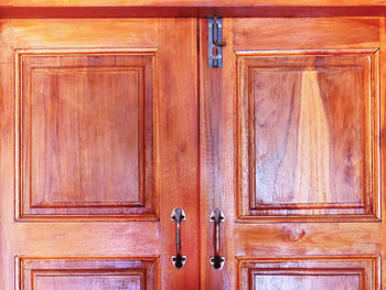 Close-up of closed wooden door of building