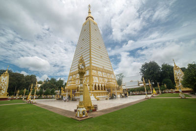 View of temple building against cloudy sky