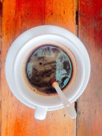 Directly above shot of coffee cup on table