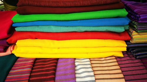 Close-up of multi colored textile sale at market stall