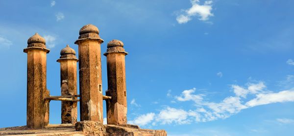 Low angle view of historical building against blue sky