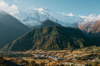 Scenic view of snowcapped mountains against sky