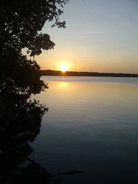 Scenic view of sea against sky at sunset