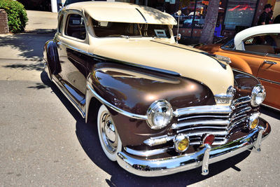 Close-up of vintage car on road