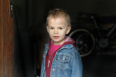Portrait of boy standing outdoors