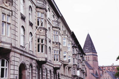 Low angle view of residential buildings against clear sky