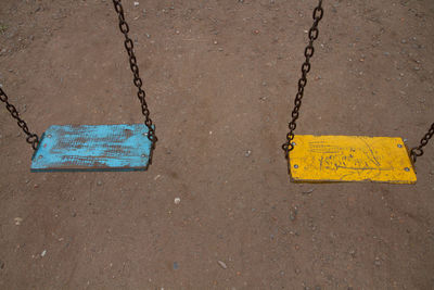 High angle view of yellow chain on road