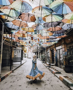 A young woman wearing a dress in the streets of istanbul.