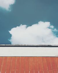 Low angle view of building against cloudy sky