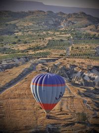 Hot air balloon flying over land in turkey 