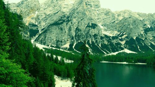 Scenic view of lake and mountains during winter