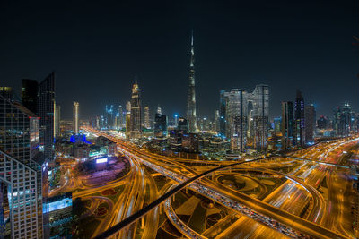 High angle view of illuminated buildings in city at night