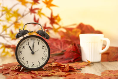 Close-up of clock on table