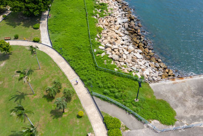 High angle view of trees by sea