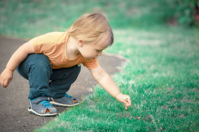 Boy playing with ball on field