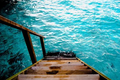 High angle view of pier by swimming pool