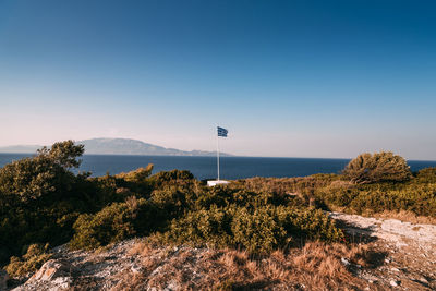 Scenic view of sea against clear blue sky