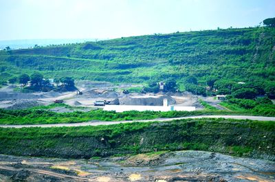 Scenic view of farm against sky