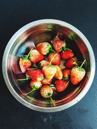 High angle view of chopped fruits in bowl on table