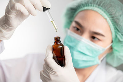 Close-up of doctor giving medicine