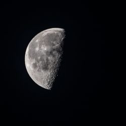 Low angle view of moon against sky at night