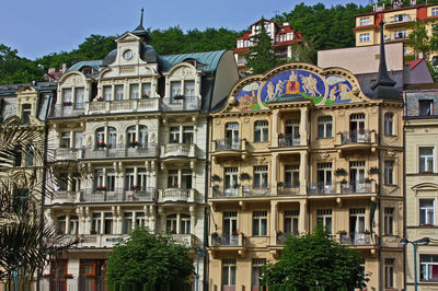 Low angle view of buildings in city against sky