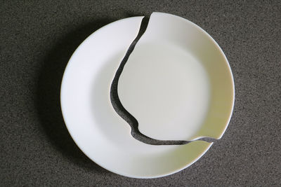 High angle view of white plate on table