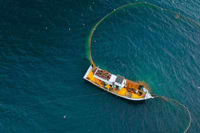 High angle view of sailboat sailing in sea