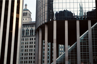 Low angle view of modern buildings against sky