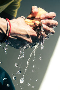 Close-up of hand holding water