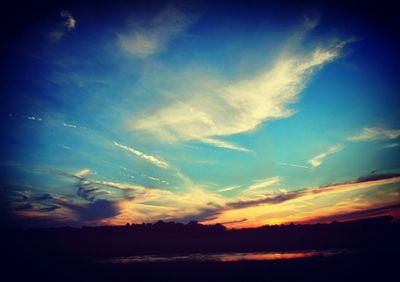 Scenic view of landscape against cloudy sky