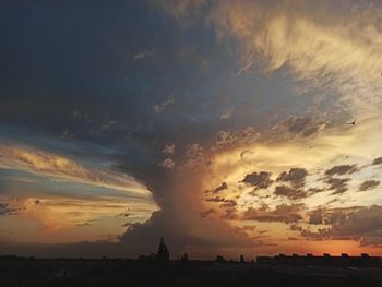 Scenic view of silhouette landscape against sky during sunset