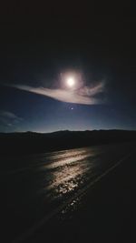 Scenic view of sea against sky at night