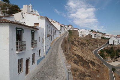Buildings in city against sky