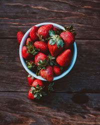 High angle view of strawberries in bowl on table