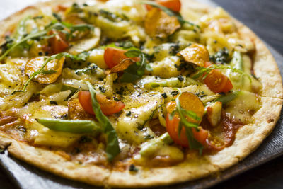 High angle view of pizza in plate on table