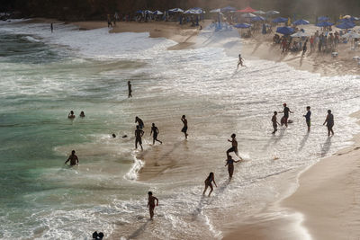 Large group of people on paciencia beach in the rio vermelho neighborhood of salvador, brazil. 