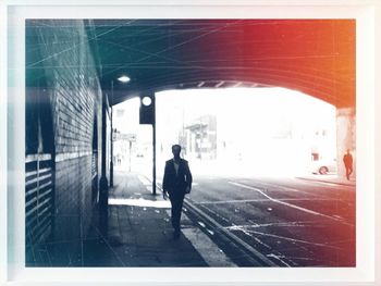 Full length of woman standing in front of building