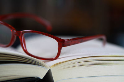 Close-up of eyeglasses on book