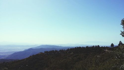 Scenic view of mountains against clear blue sky