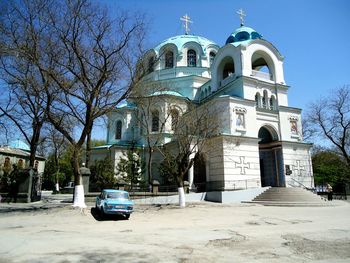 View of church by building against sky