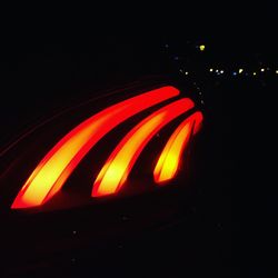 Close-up of illuminated car at night