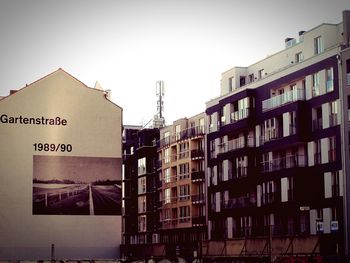 View of buildings in city against sky