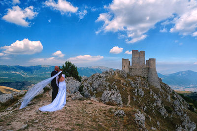Woman on landscape against sky