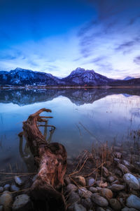 Scenic view of lake and mountains against sky