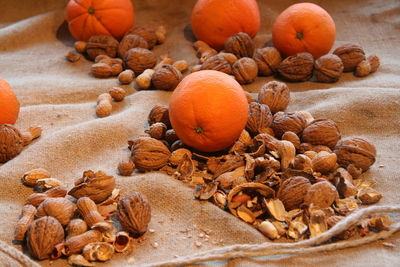 Close-up of oranges and walnuts, christmas theme