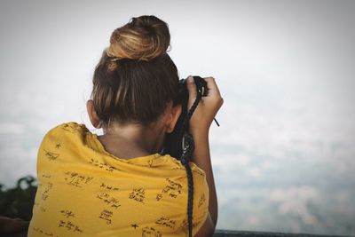 Rear view of girl with hair bun