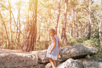 23.07.2021 turkey, kemer kid girl traveler of eight years old explore ancient excavations of ruins