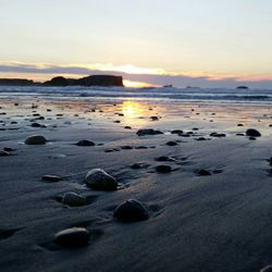 Scenic view of sea at sunset